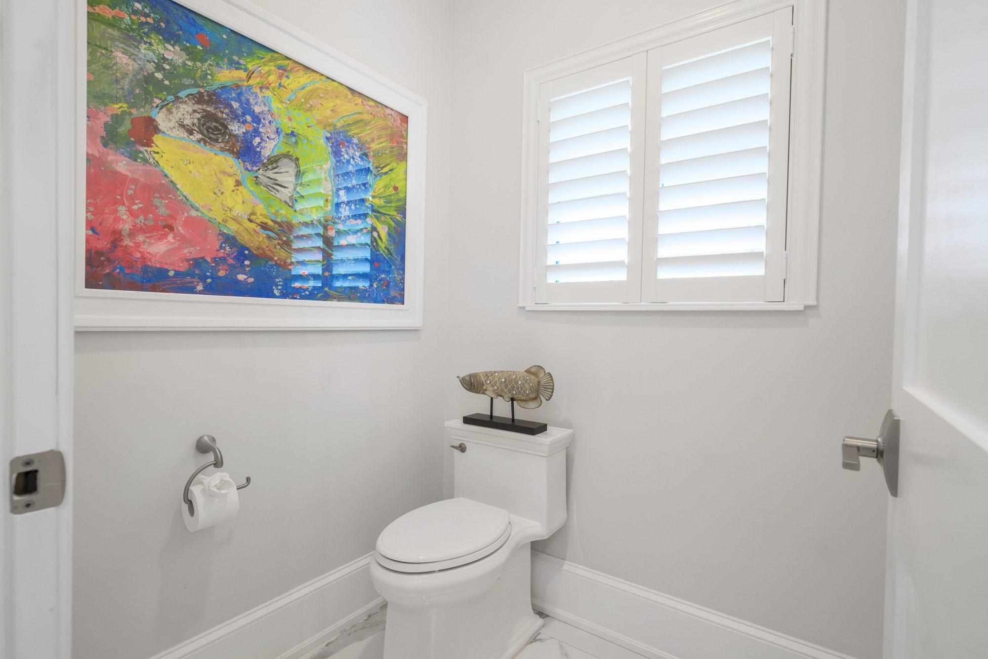 Half bath with colorful wall art