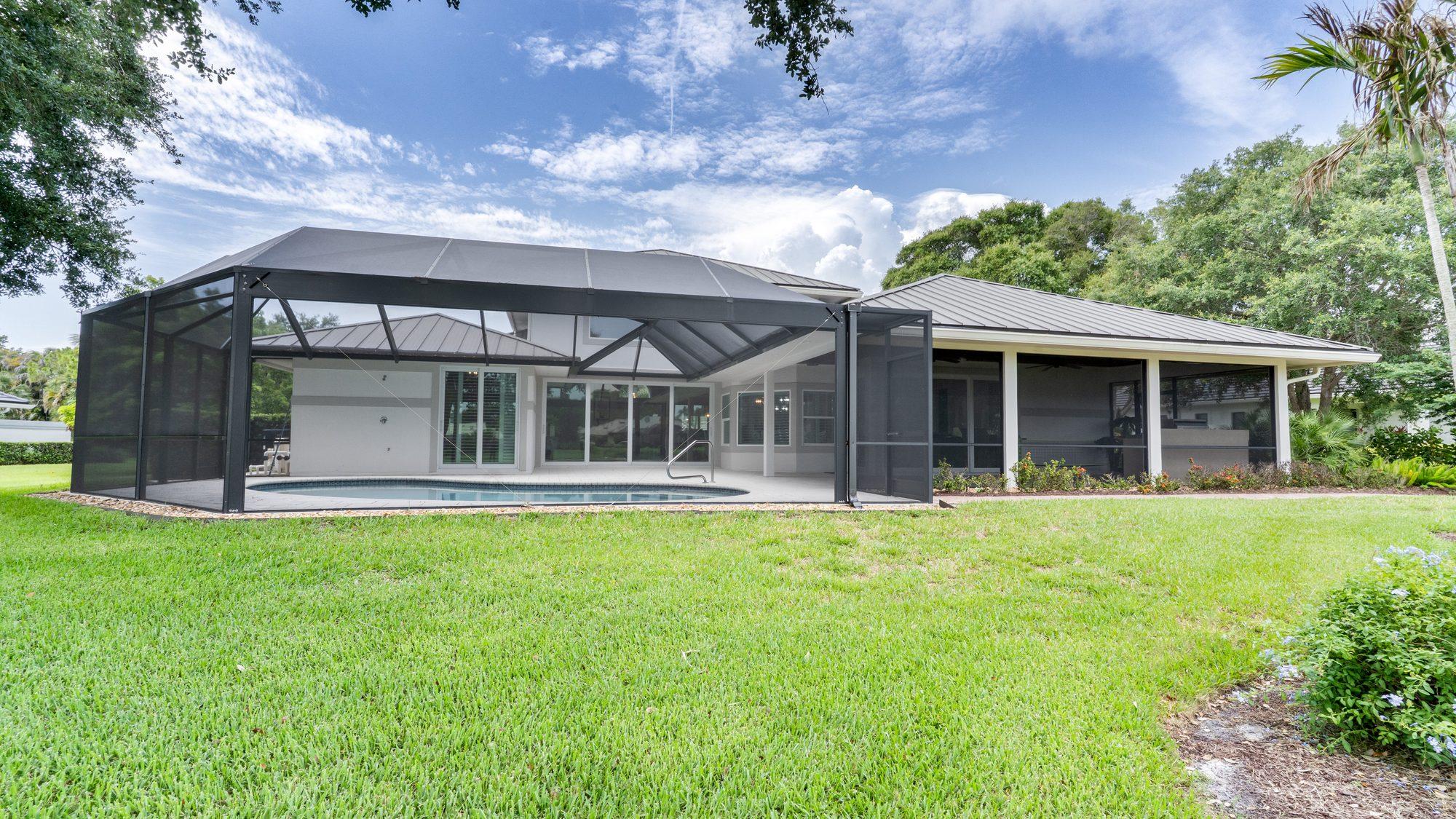 Rear exterior with screened pool enclosure